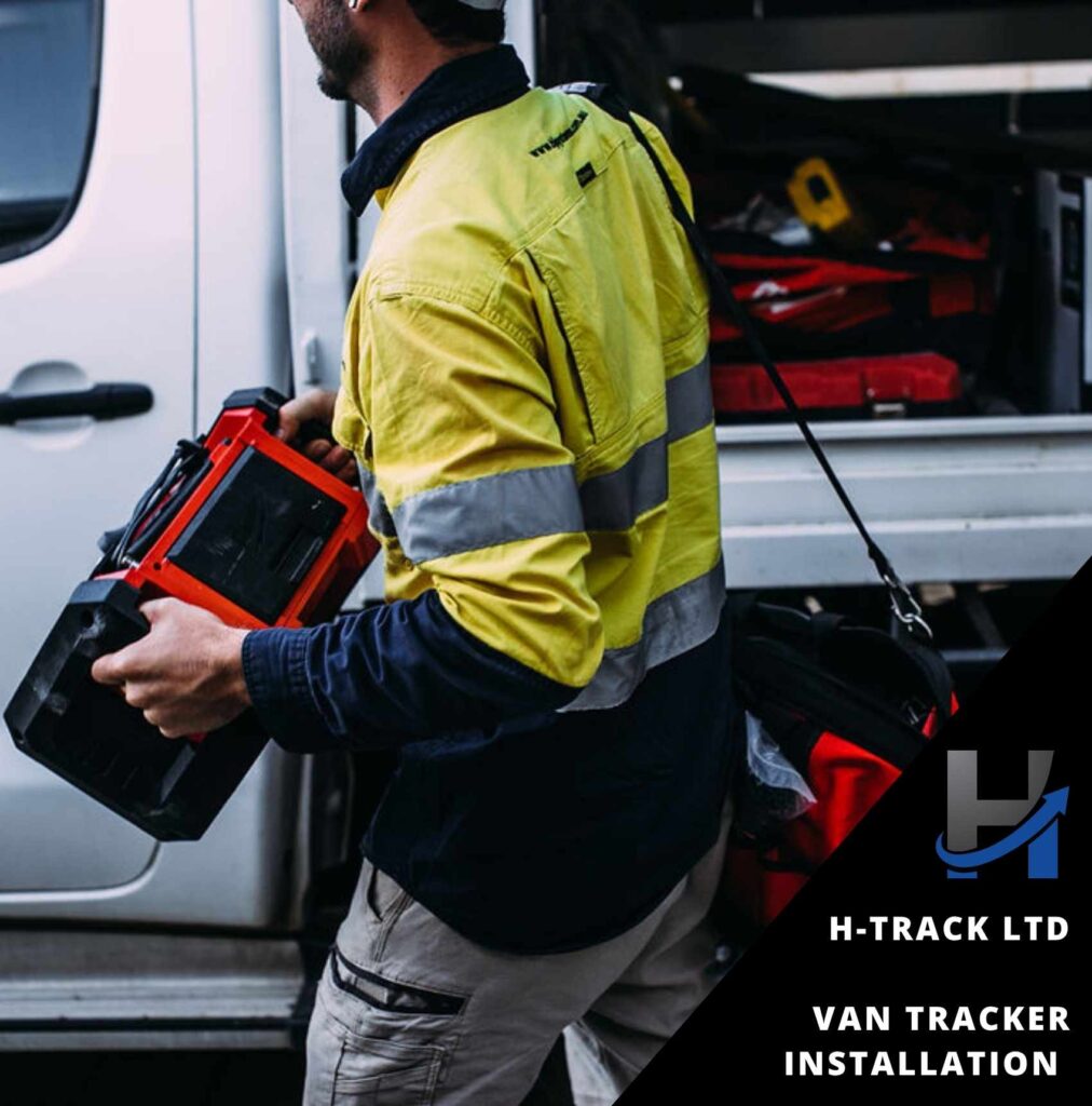 Workman in high viz top carrying electrical equipment from works van with side door open after van tracker installation by H-Track Ltd